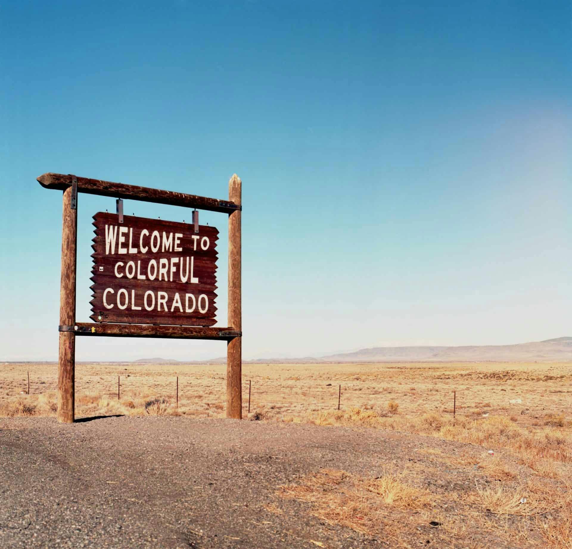 photo of a a sign that says "welcome to colorful Colorado"
